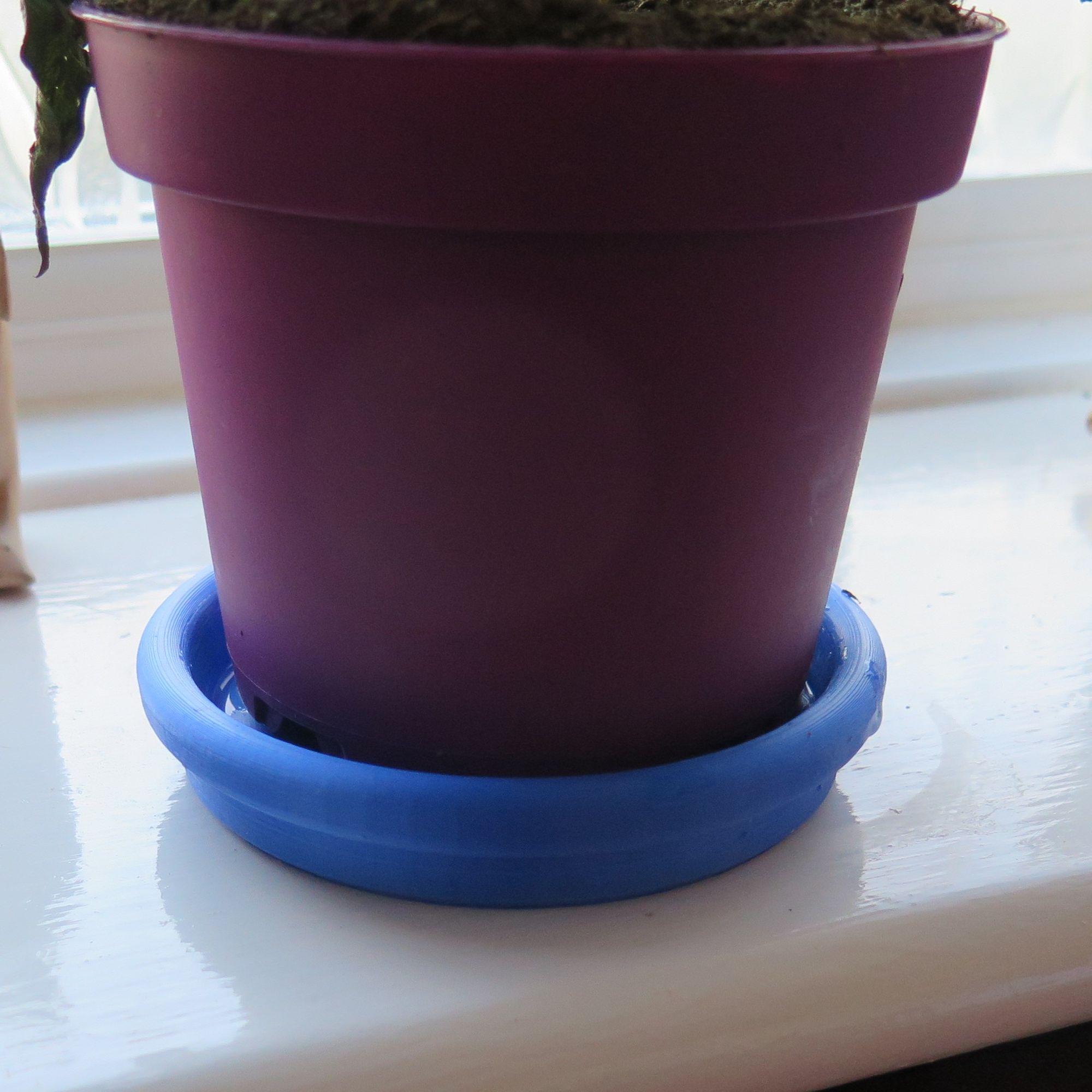 Window sill plant drip saucer